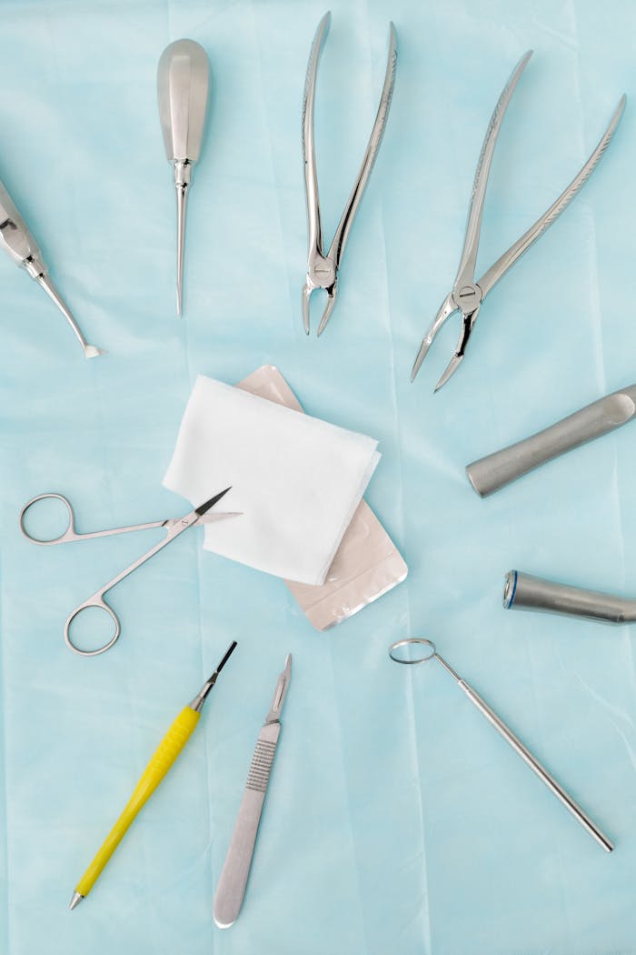 Set of dental tools on blue surface